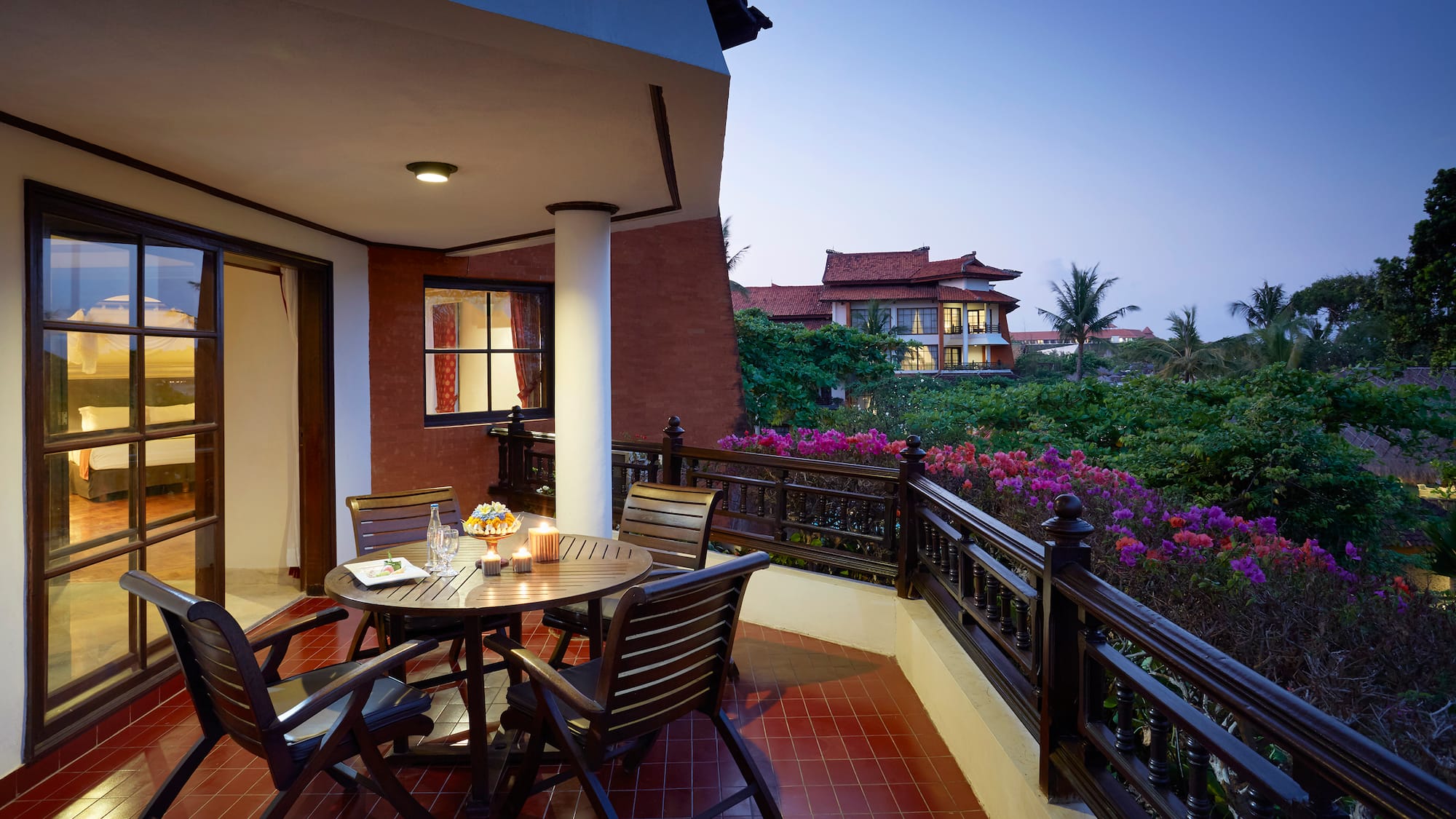 a table and chairs on a balcony