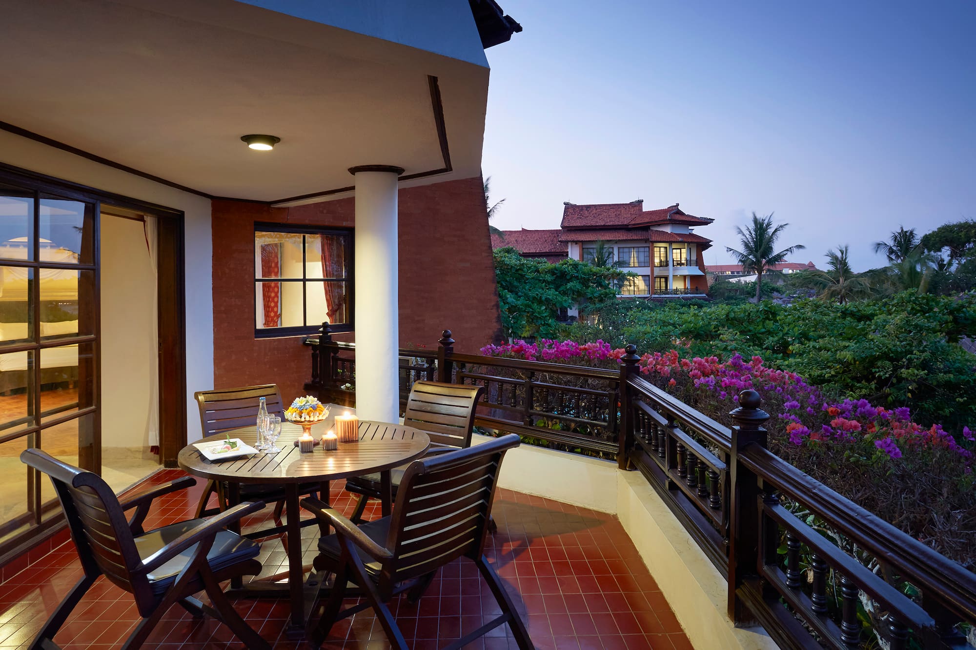 a table and chairs on a balcony