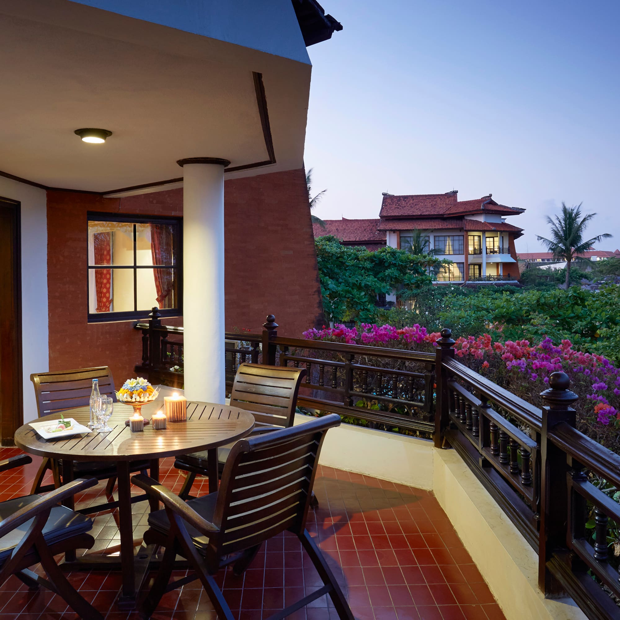 a table and chairs on a balcony