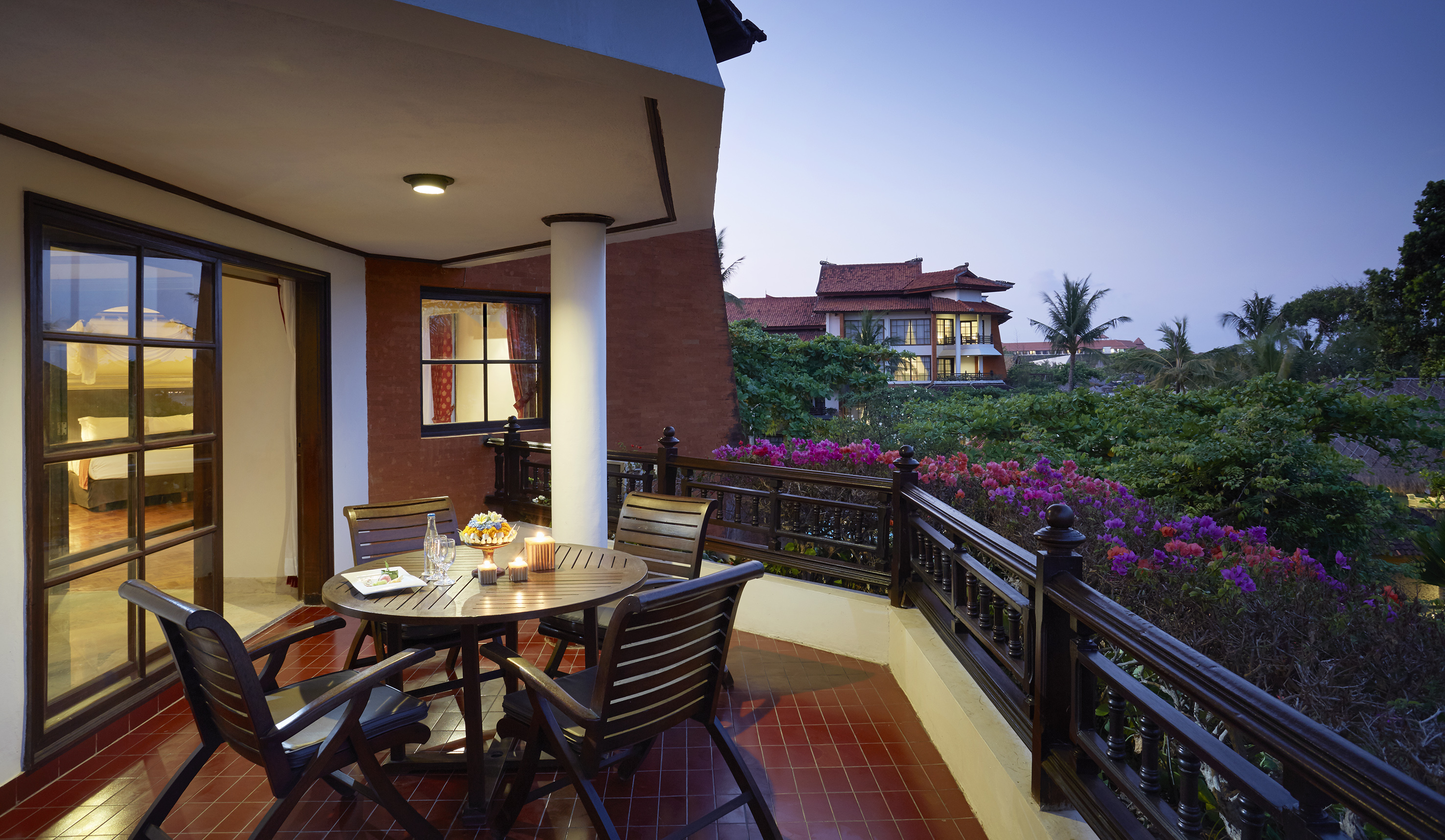 a table and chairs on a balcony