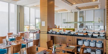 a restaurant with tables and chairs