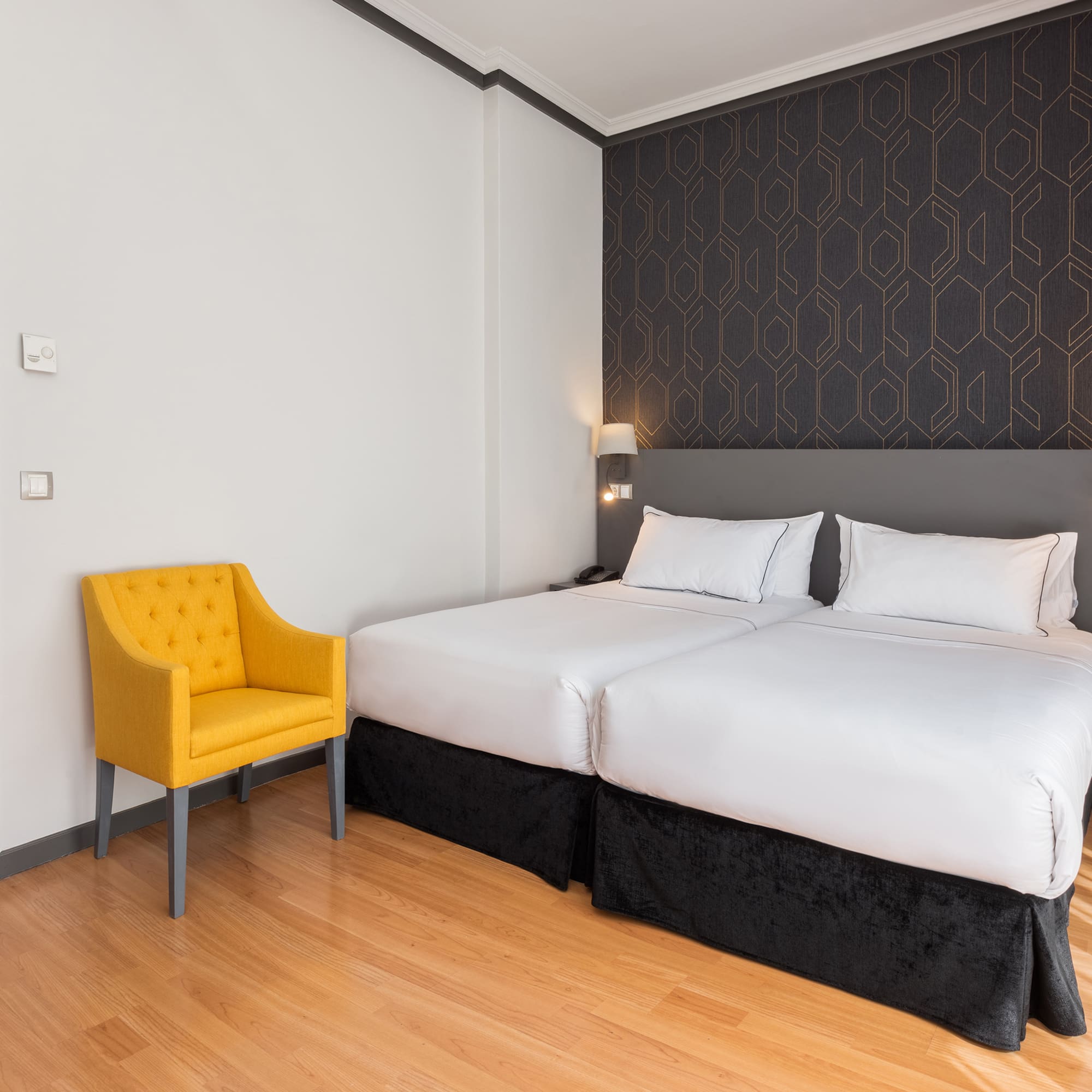 a room with a bed and a chair