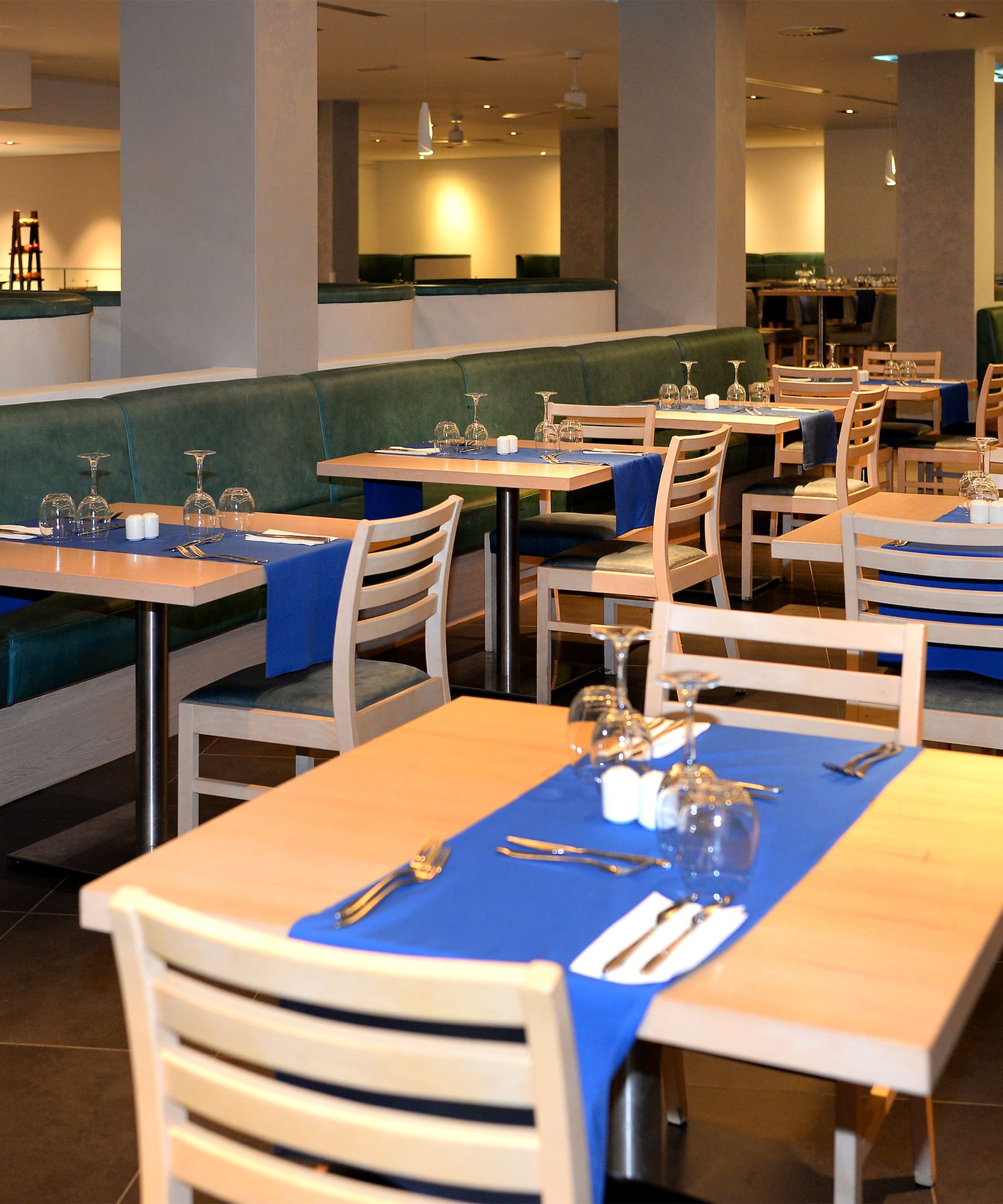 a restaurant with tables and chairs