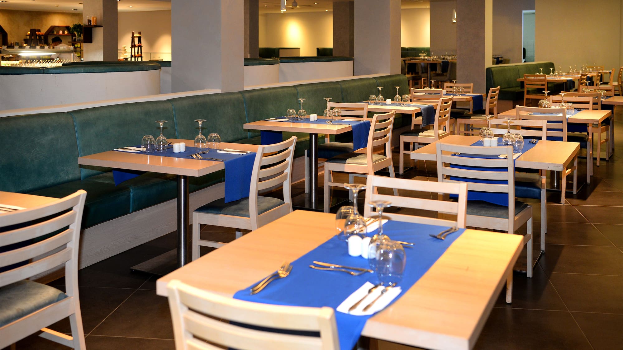 a restaurant with tables and chairs