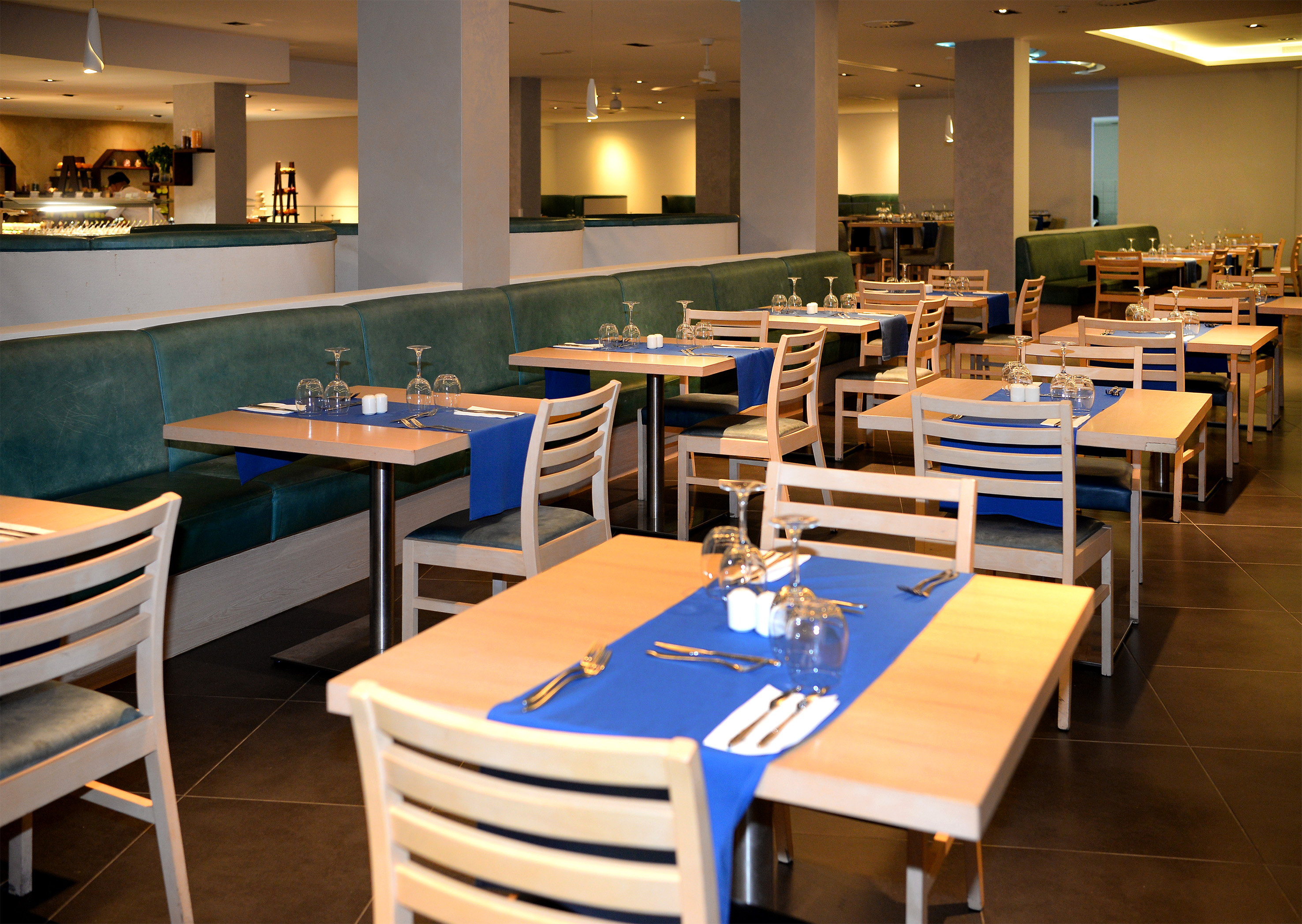 a restaurant with tables and chairs