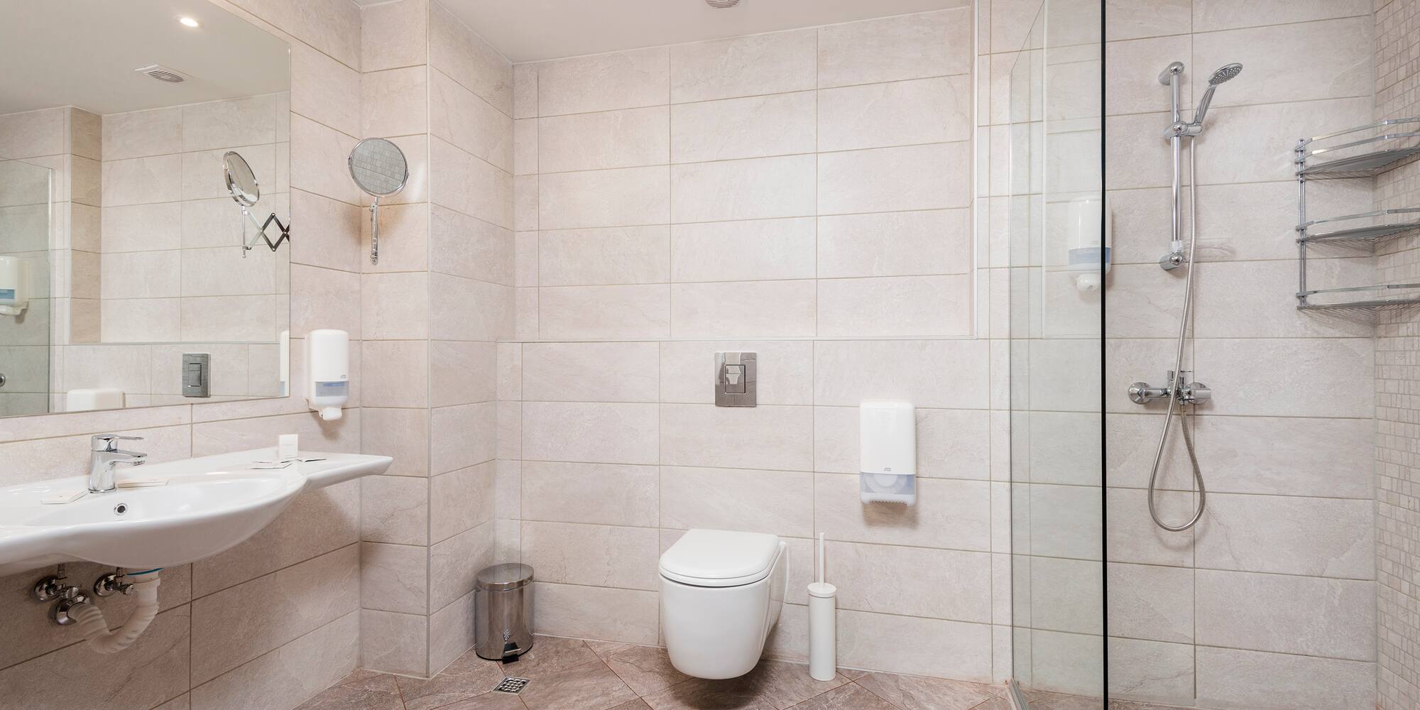 a bathroom with a shower and toilet
