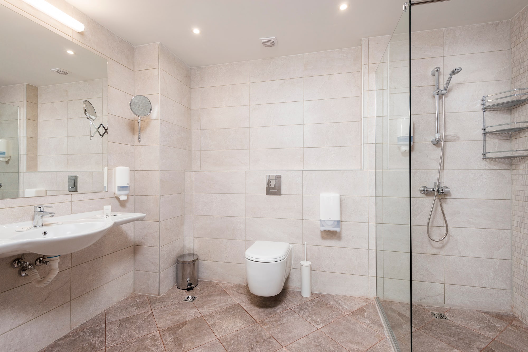 a bathroom with a shower and toilet