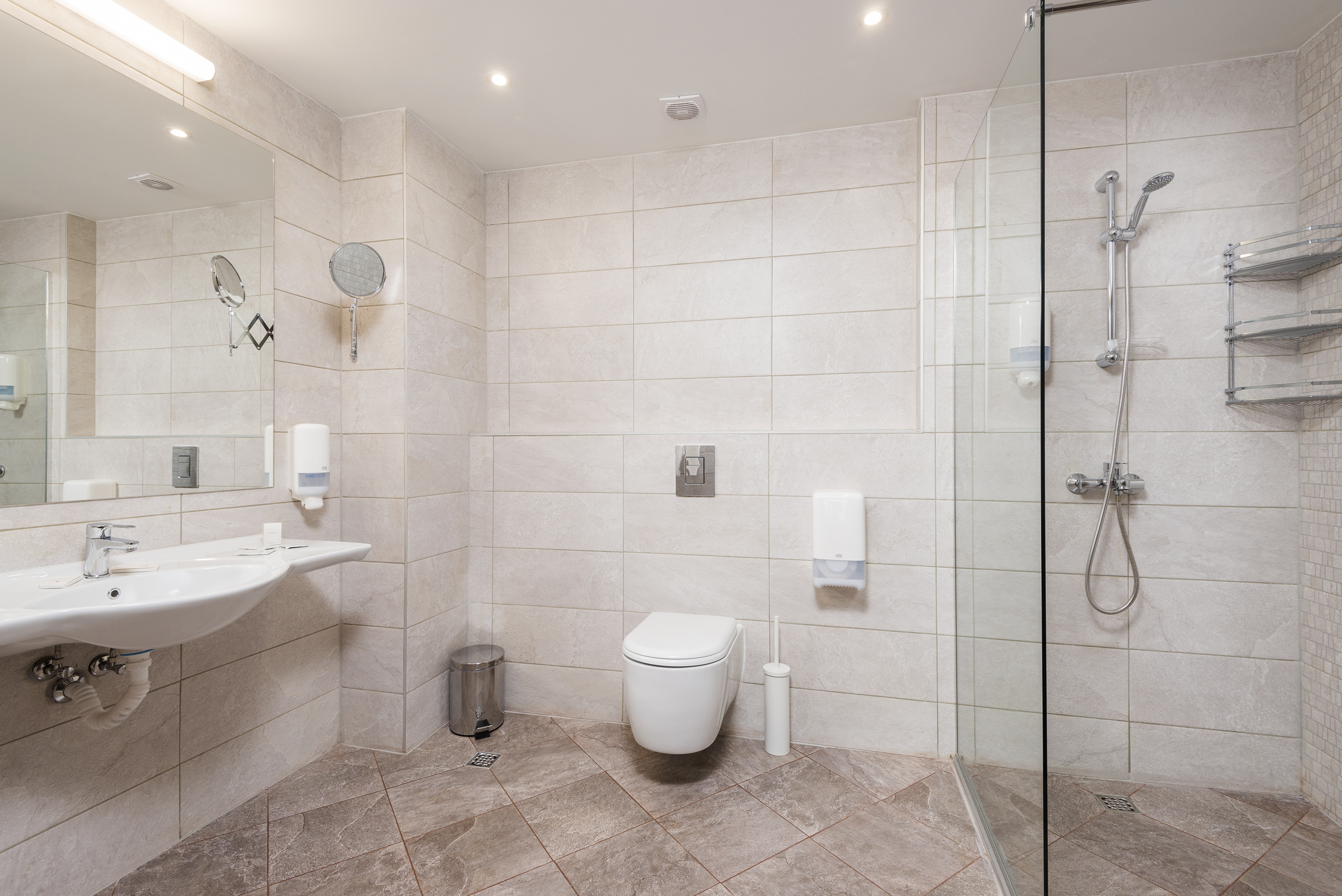 a bathroom with a shower and toilet