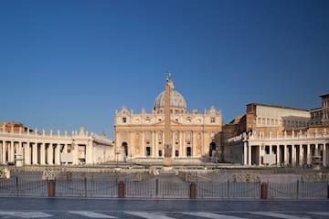 a large building with a dome and a pillar