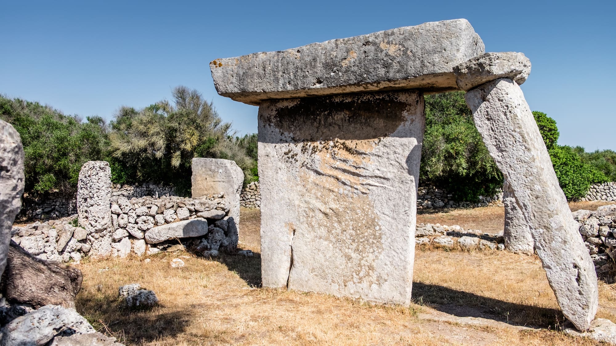 a large stone structure in a field