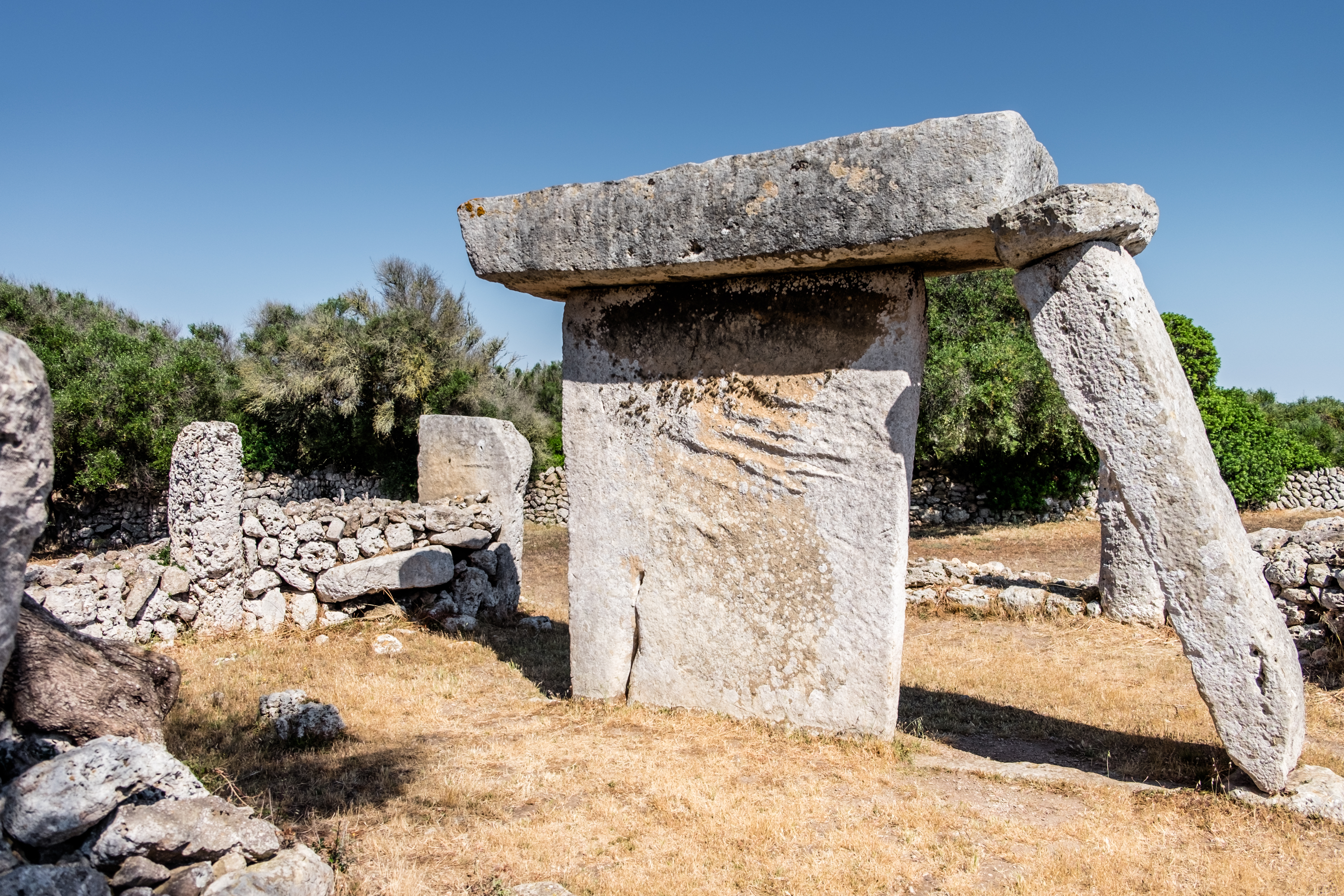 a large stone structure in a field