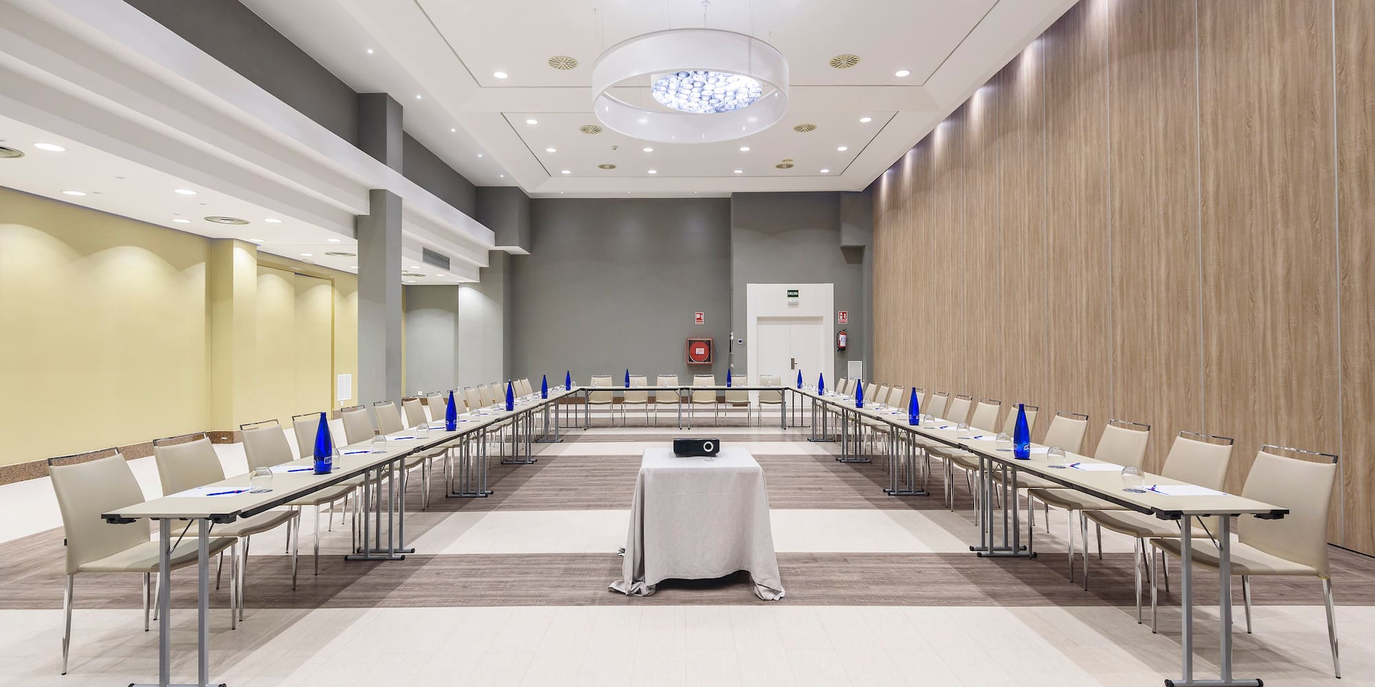 a room with many chairs and tables