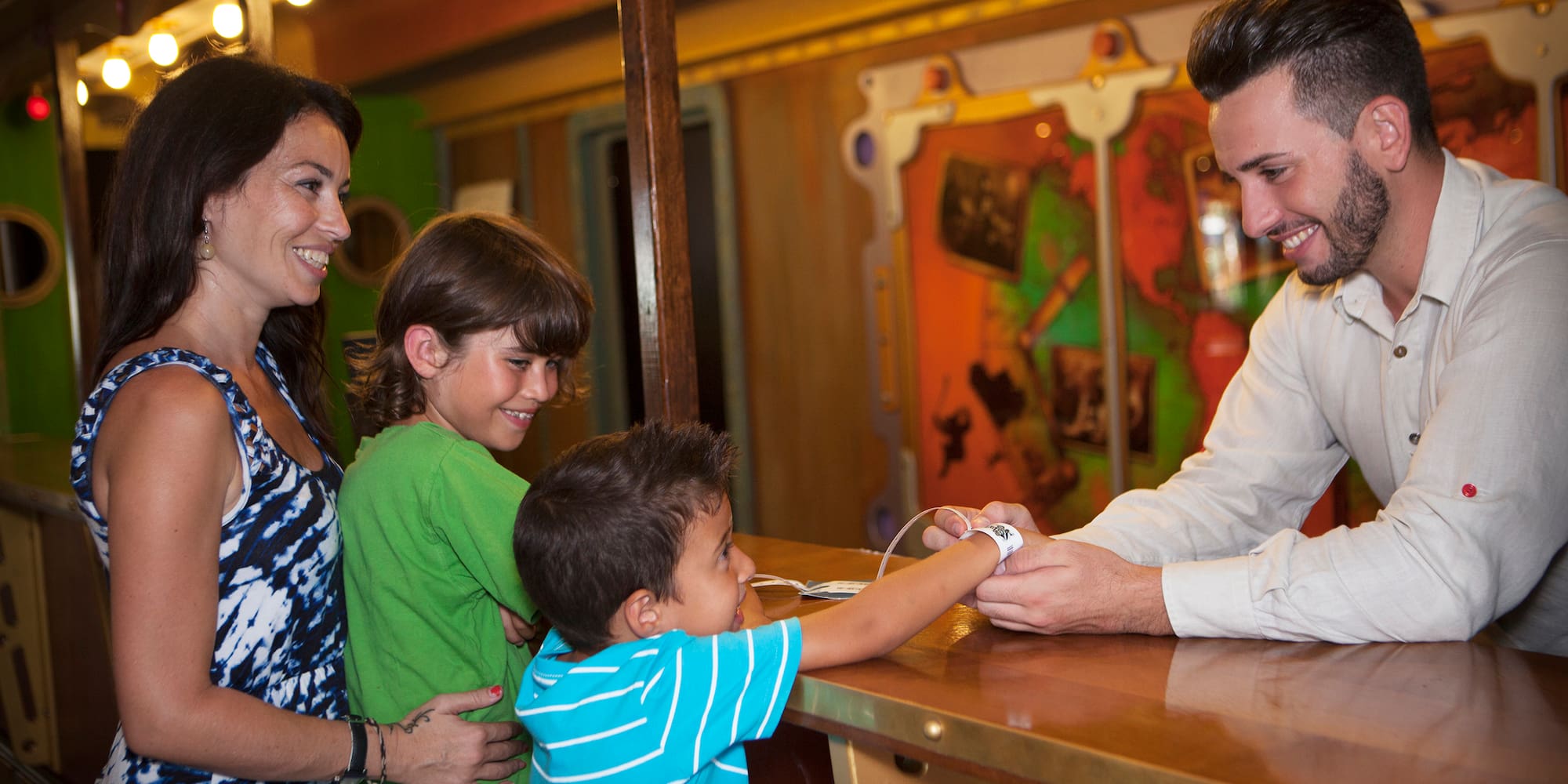 a man and woman standing next to a couple of children