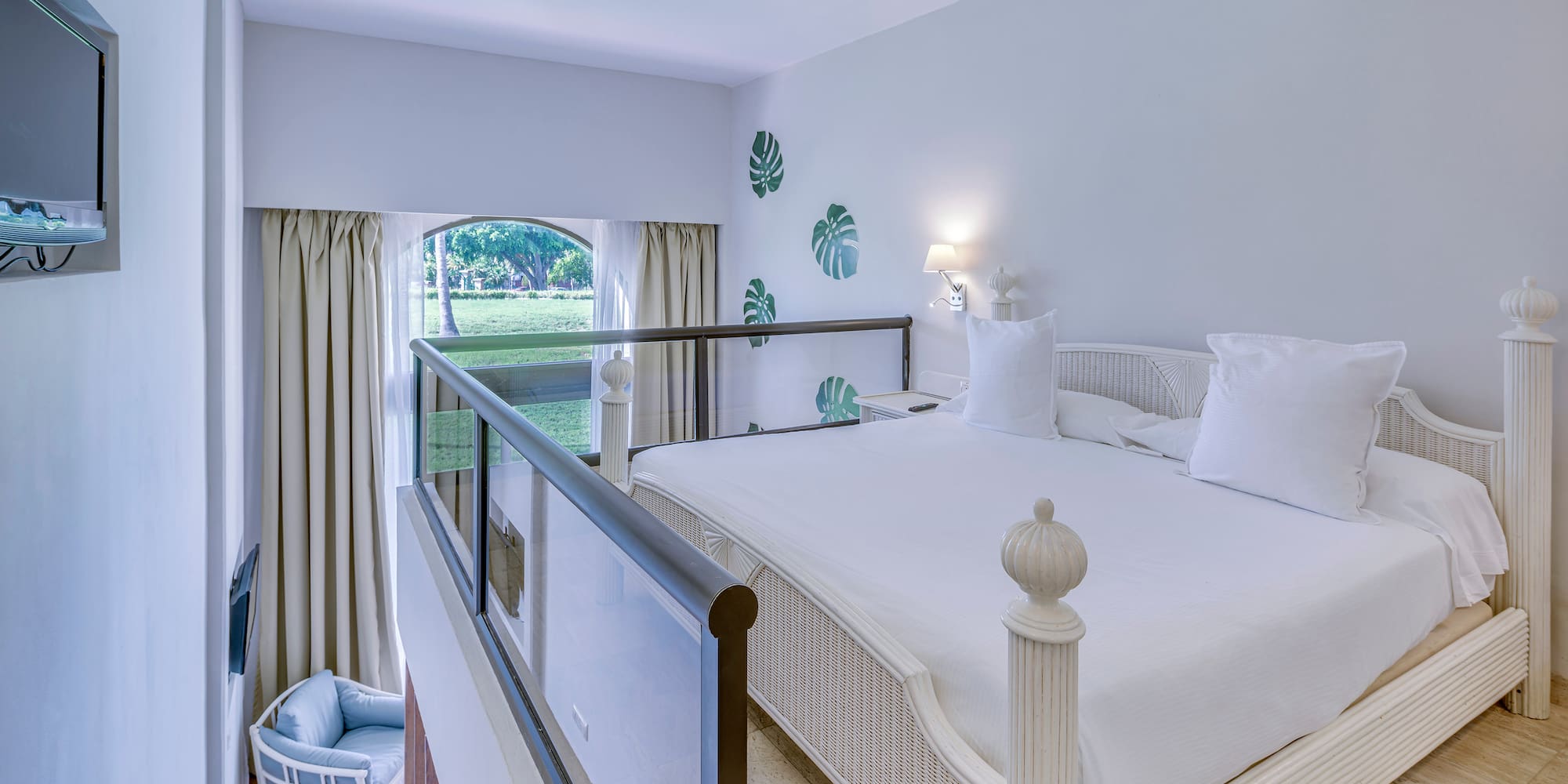 a bedroom with a bed and a balcony