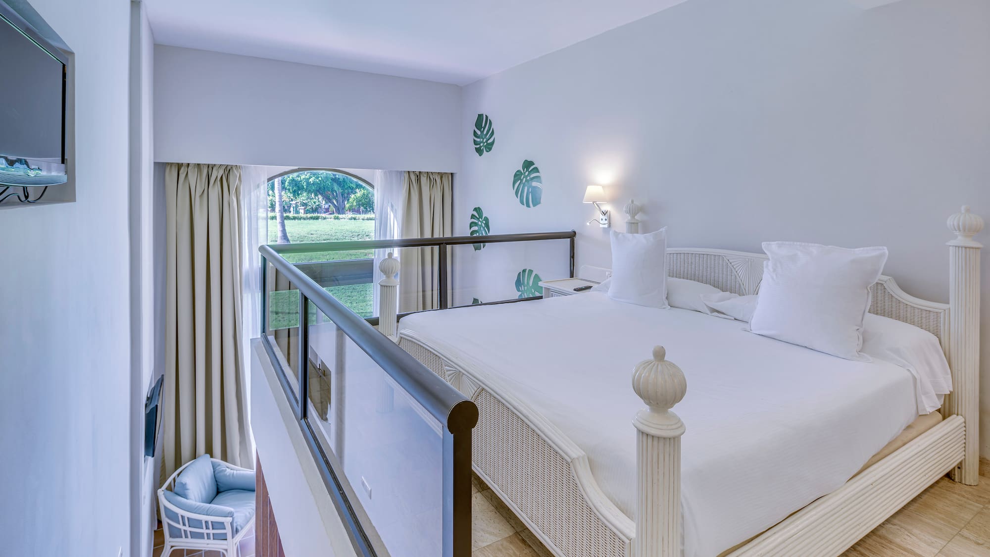 a bedroom with a bed and a balcony