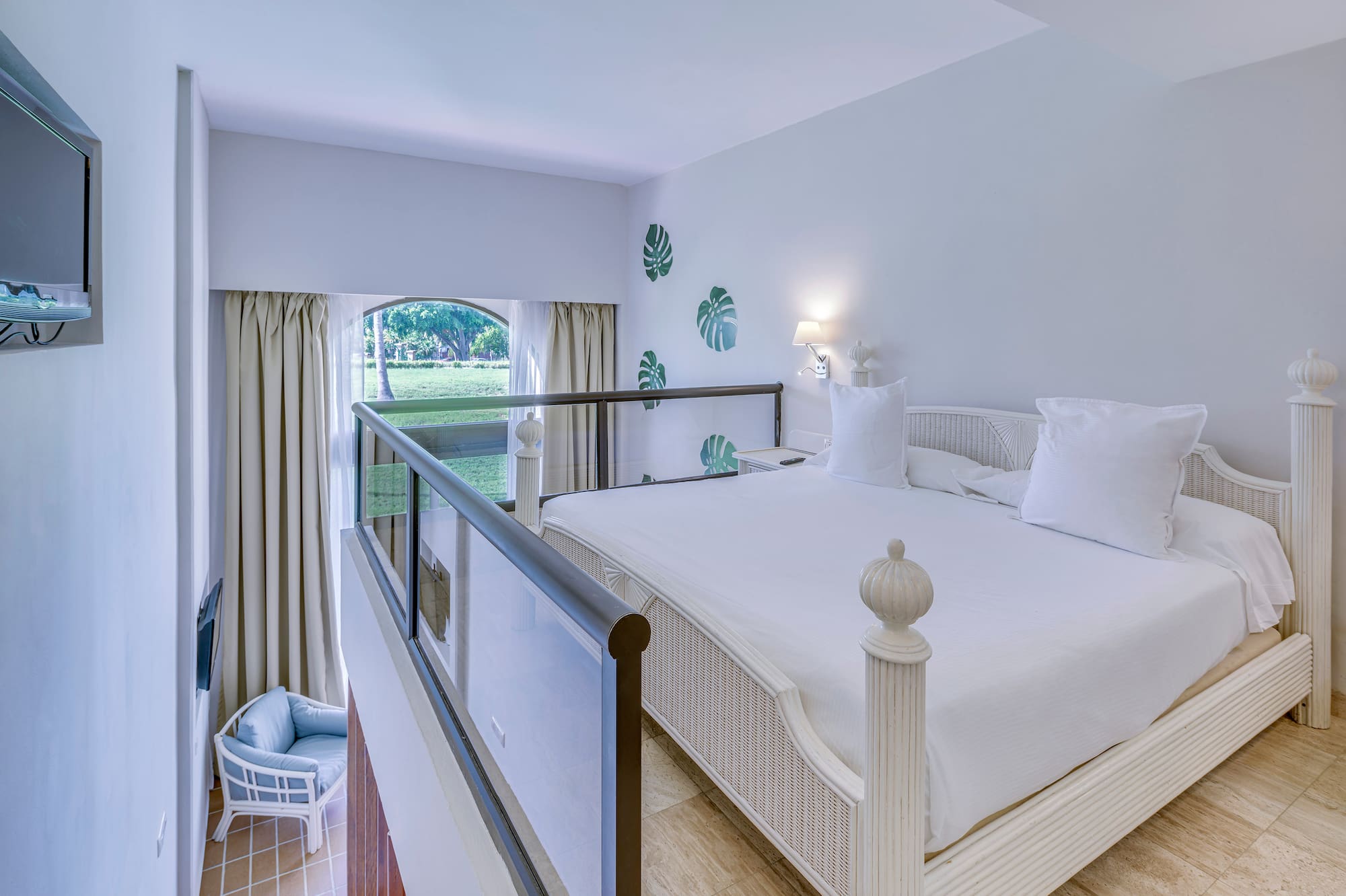 a bedroom with a bed and a balcony