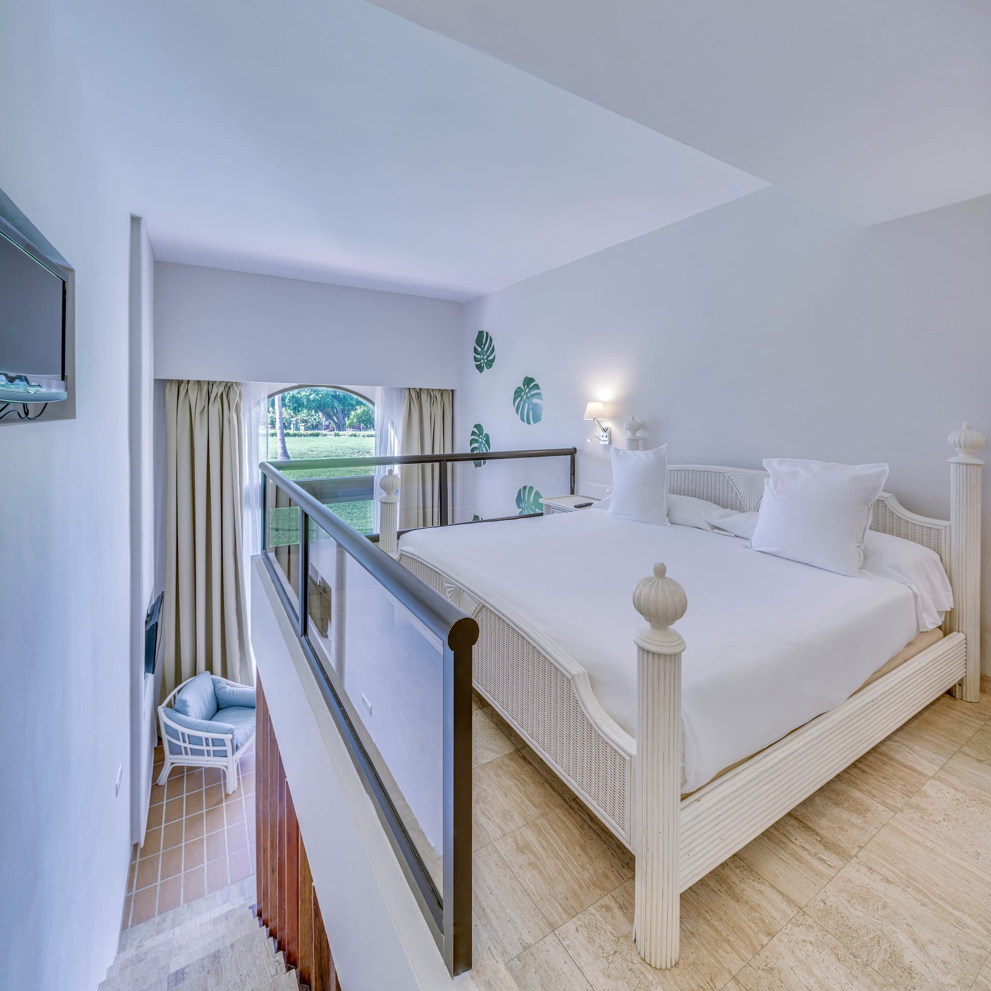 a bedroom with a bed and a balcony