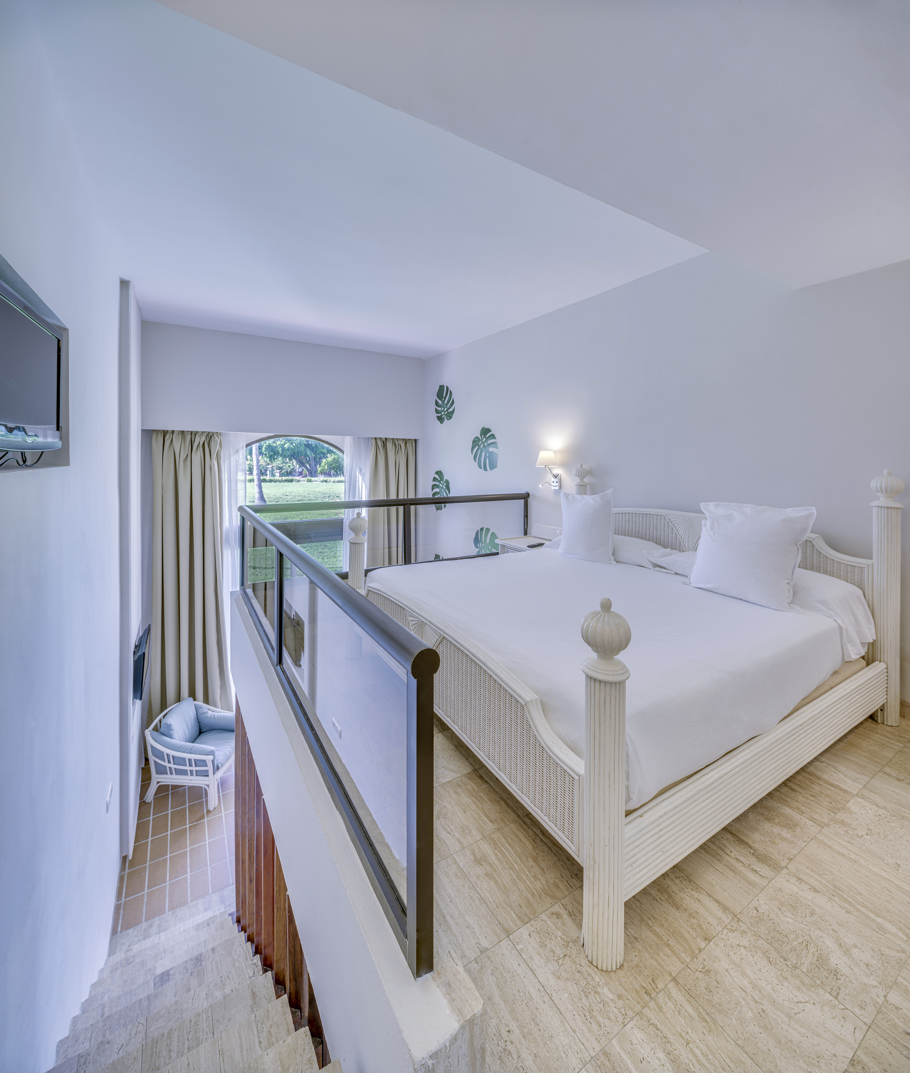 a bedroom with a bed and a balcony