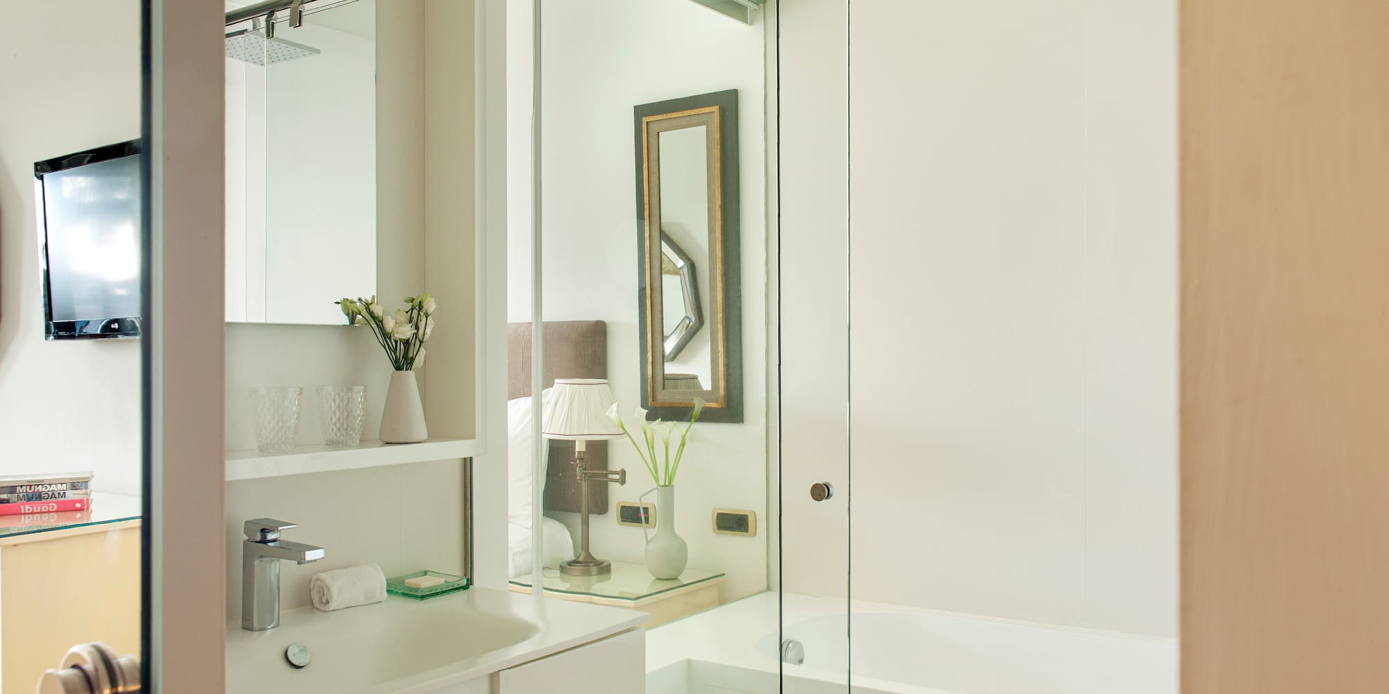 a bathroom with a glass shower door
