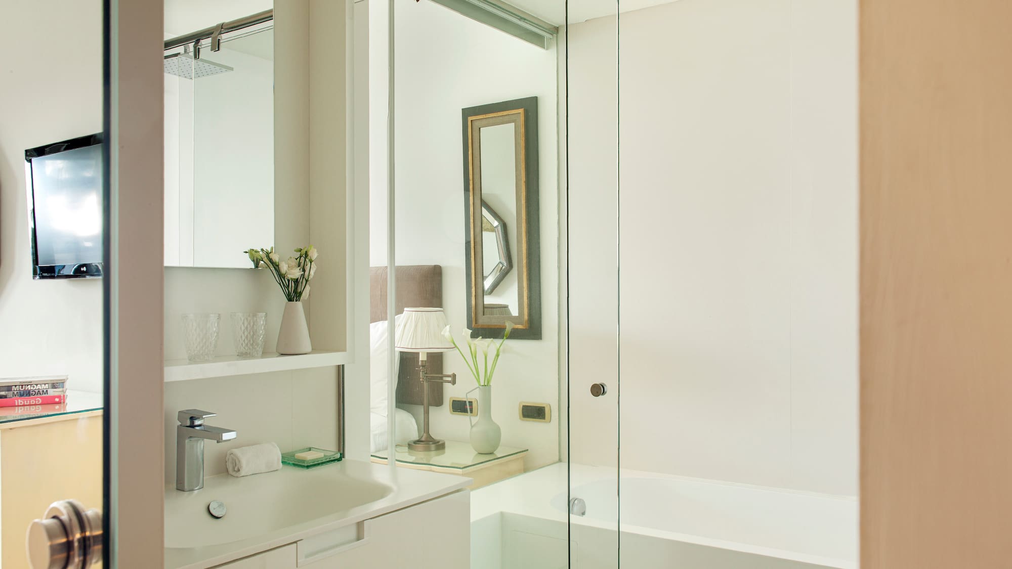 a bathroom with a glass shower door
