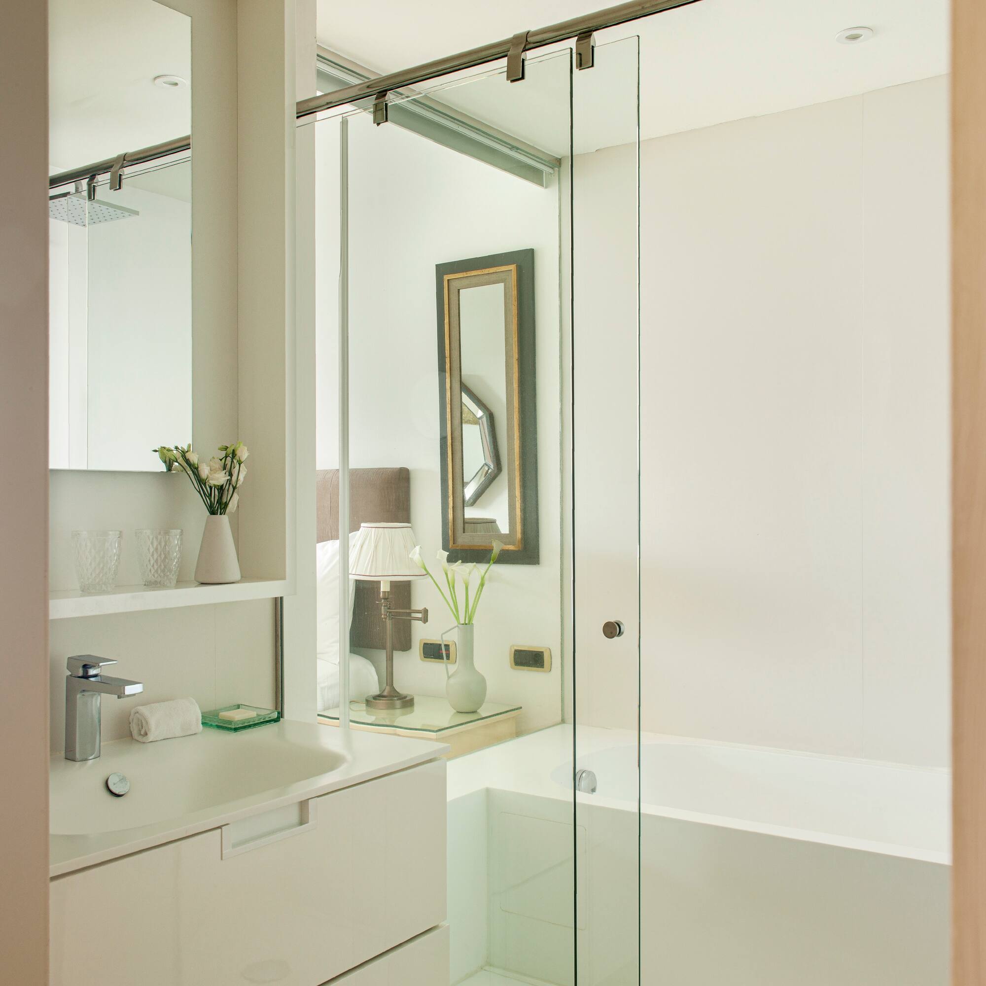 a bathroom with a glass shower door