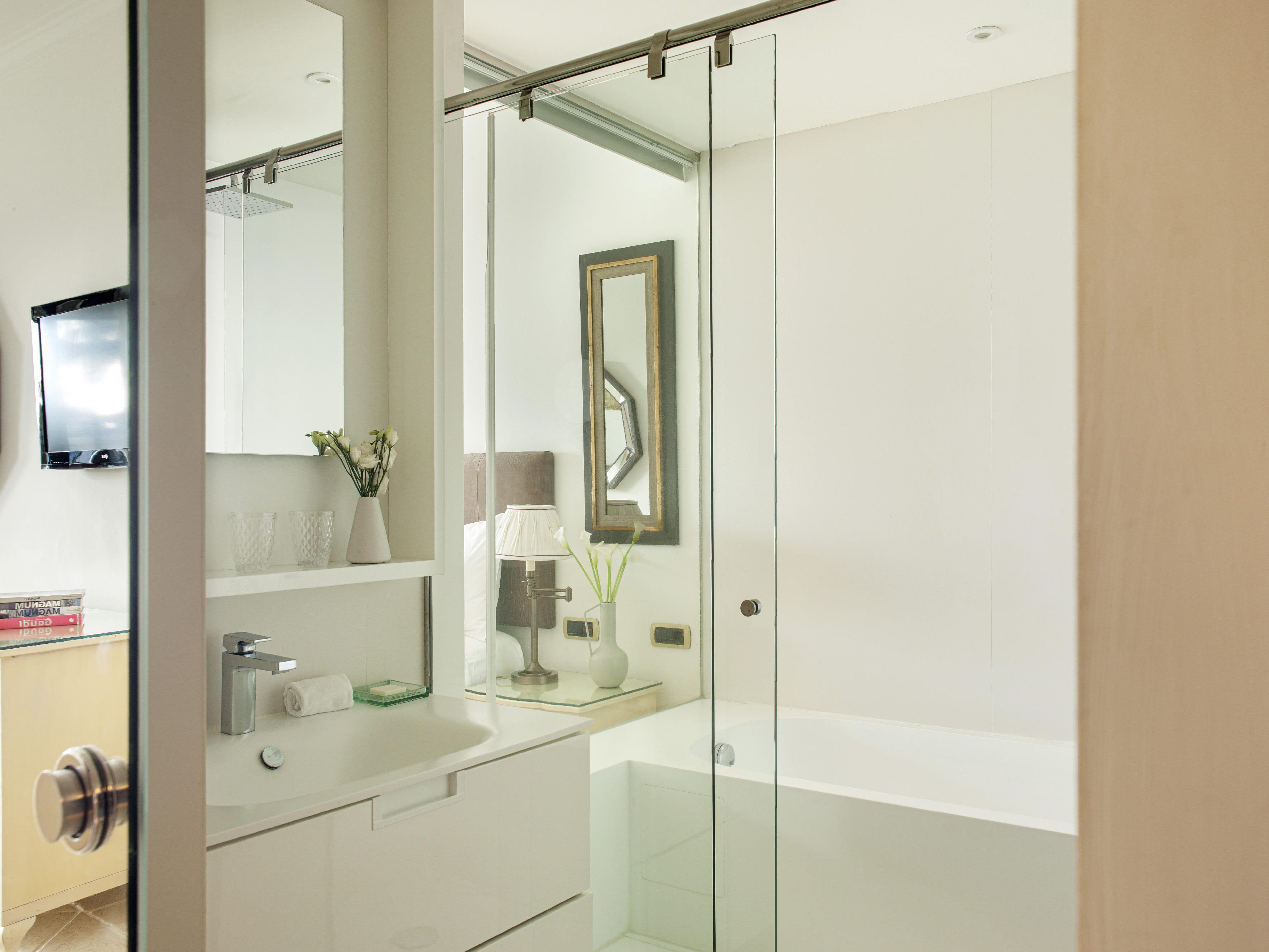 a bathroom with a glass shower door