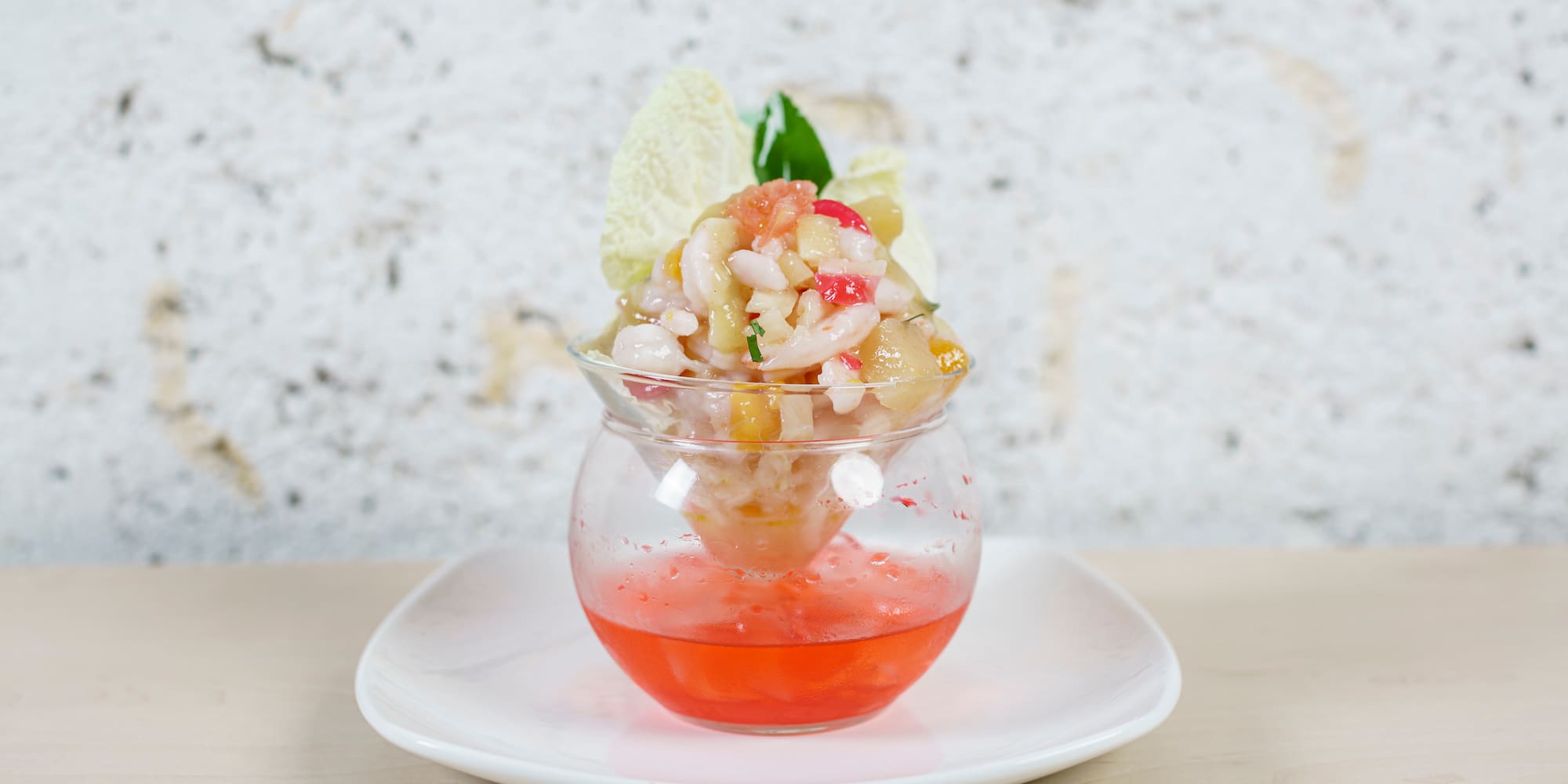 a glass bowl with food in it