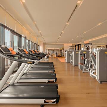a large room with treadmills and exercise equipment