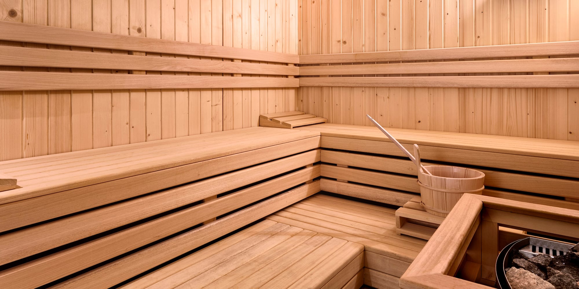 a wooden sauna with bucket and bucket
