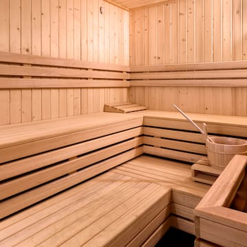 a wooden sauna with bucket and bucket