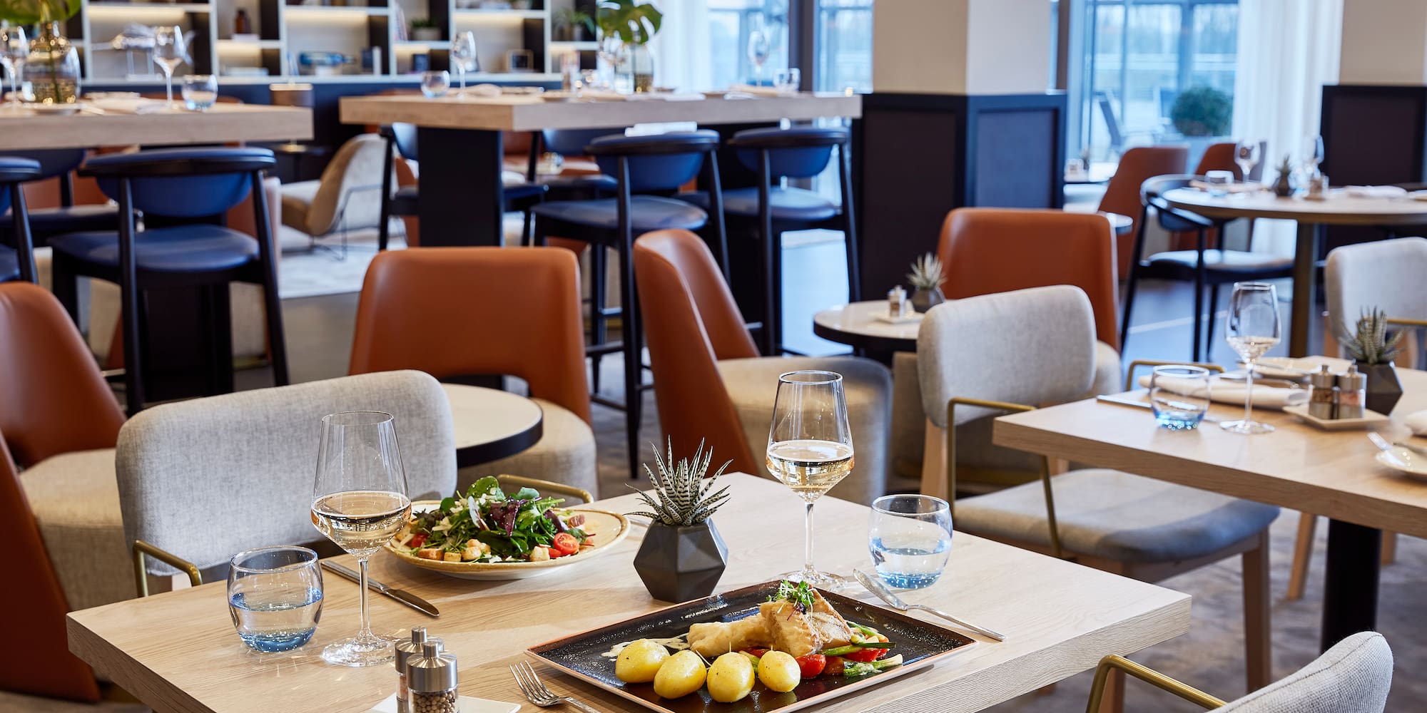 a restaurant with tables and chairs