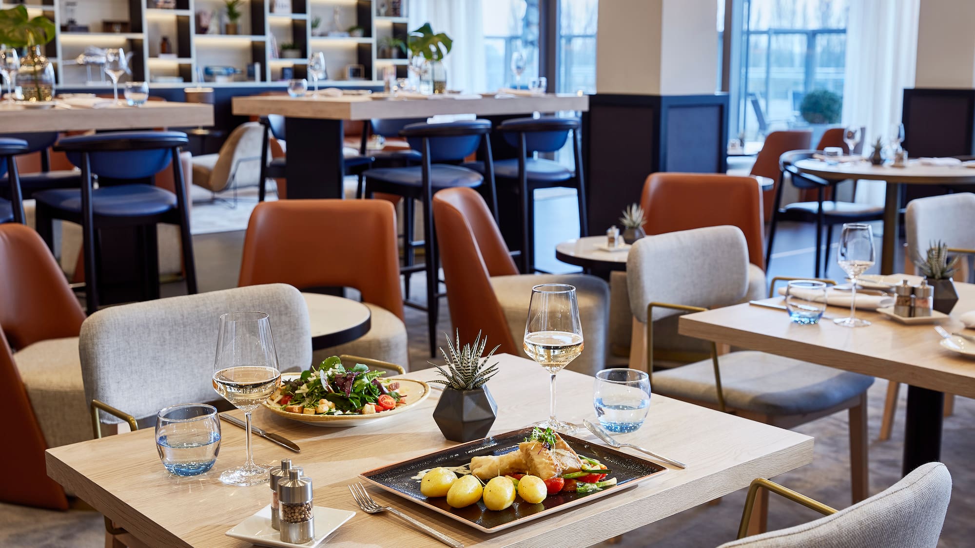 a restaurant with tables and chairs