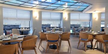 a room with tables and chairs