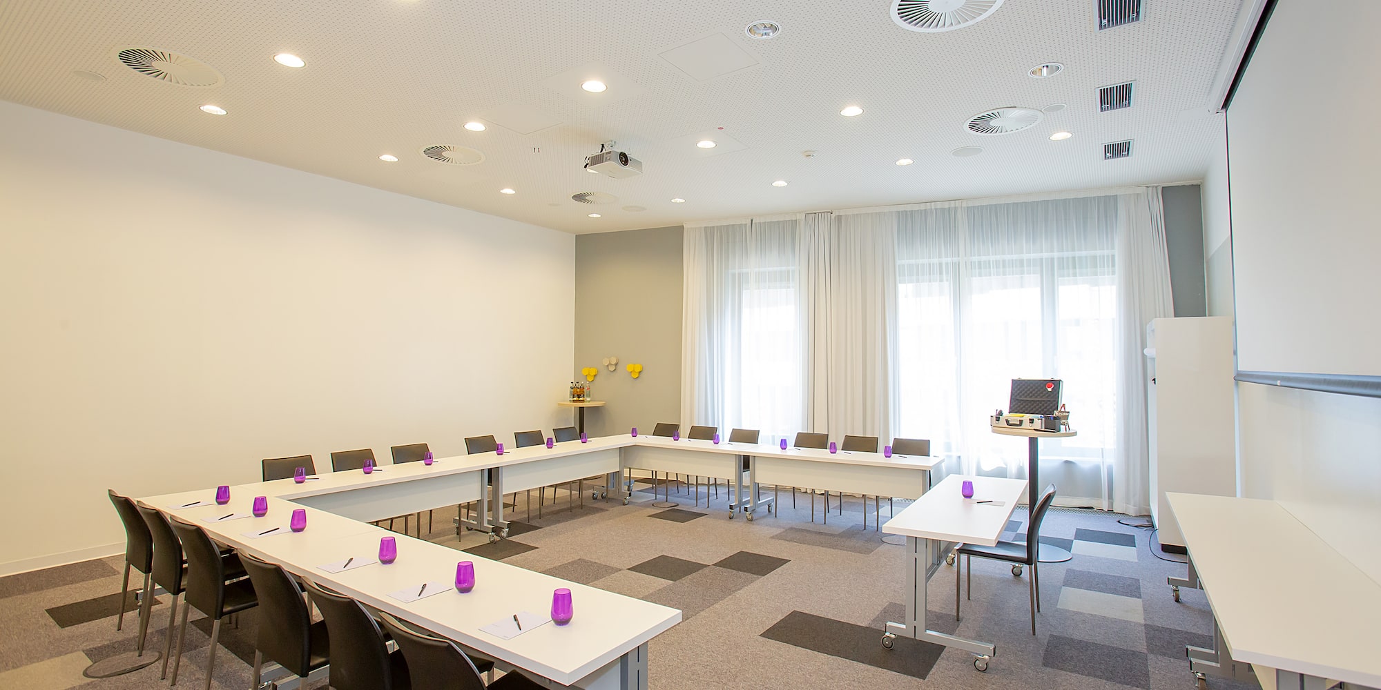 a room with tables and chairs