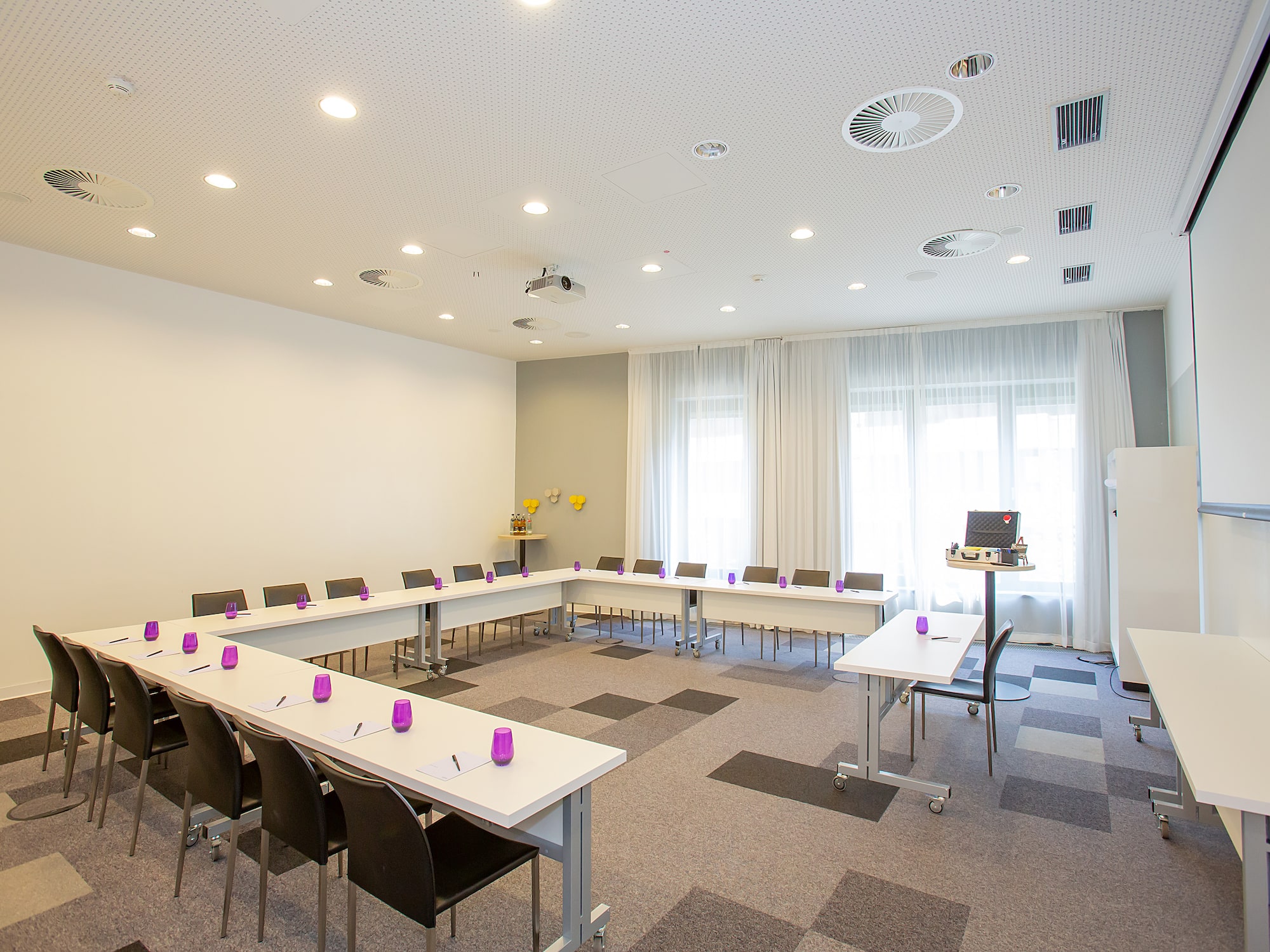 a room with tables and chairs