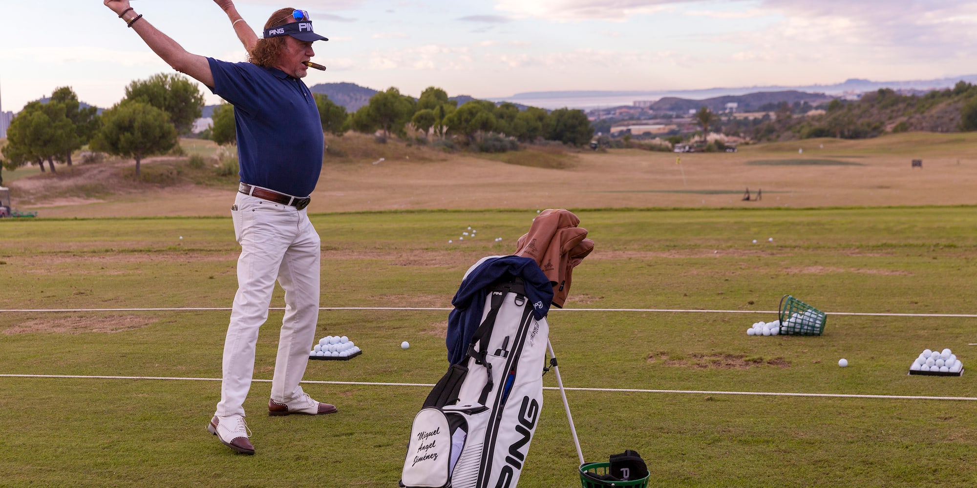 a man holding a golf club