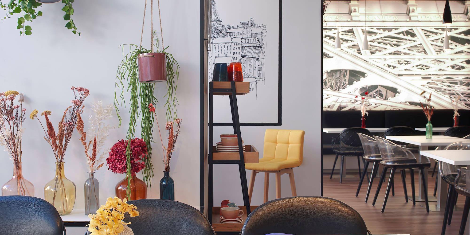 a table with a book and vases of flowers
