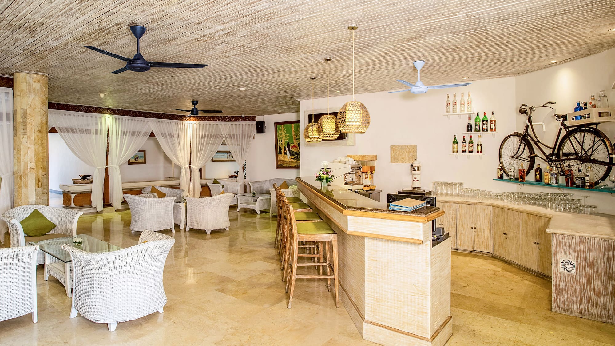 a room with a bar and chairs