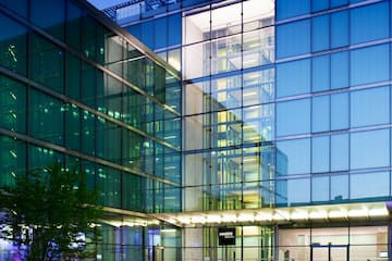 a building with glass walls and a walkway