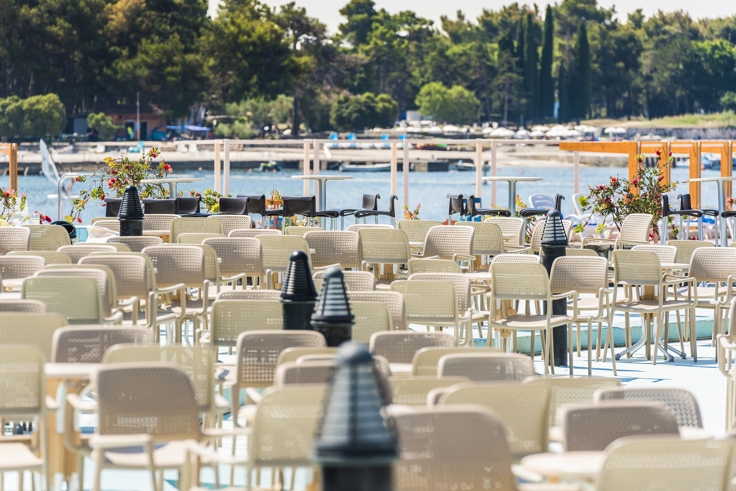 a group of chairs and tables outside