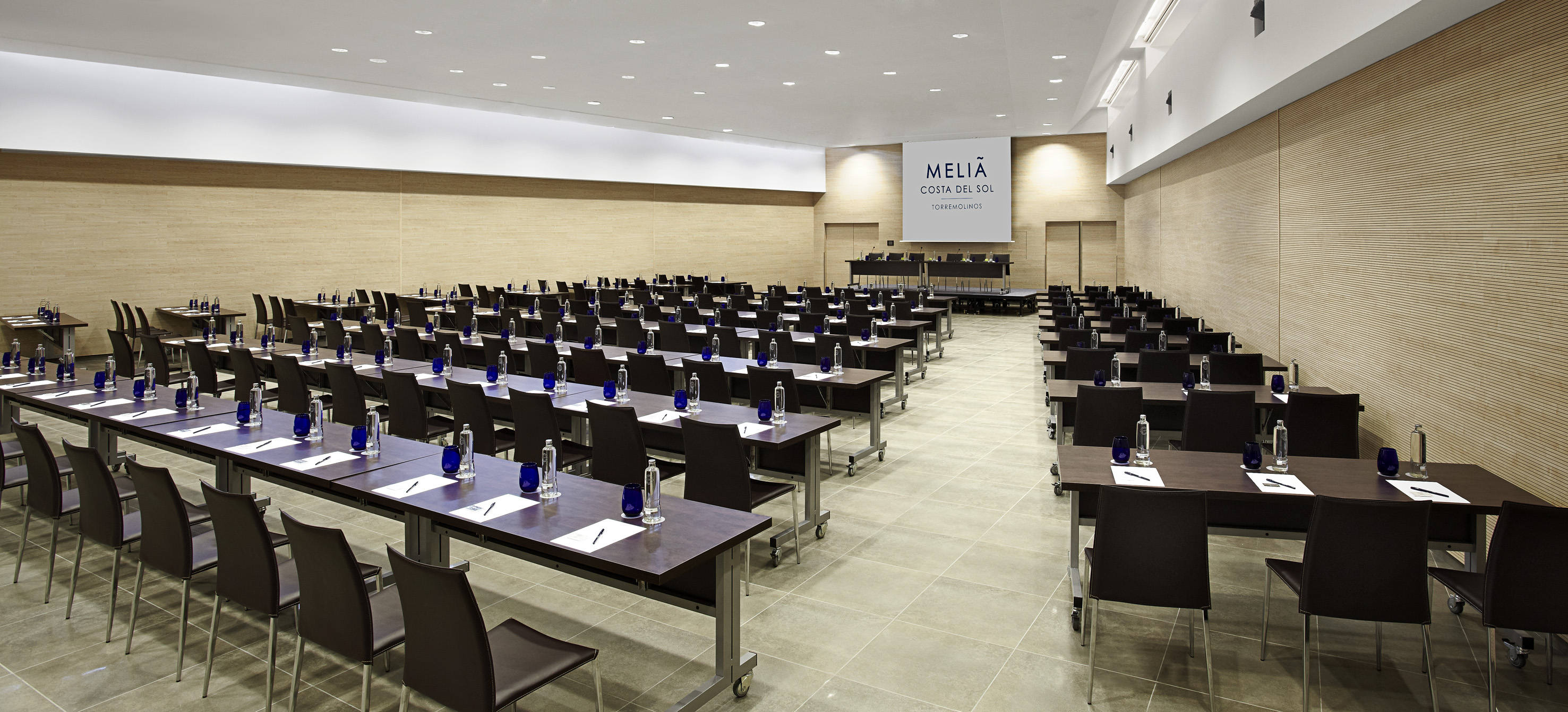 Melia Costa del Sol Torremolinos meeting room, tables, chairs, screen.