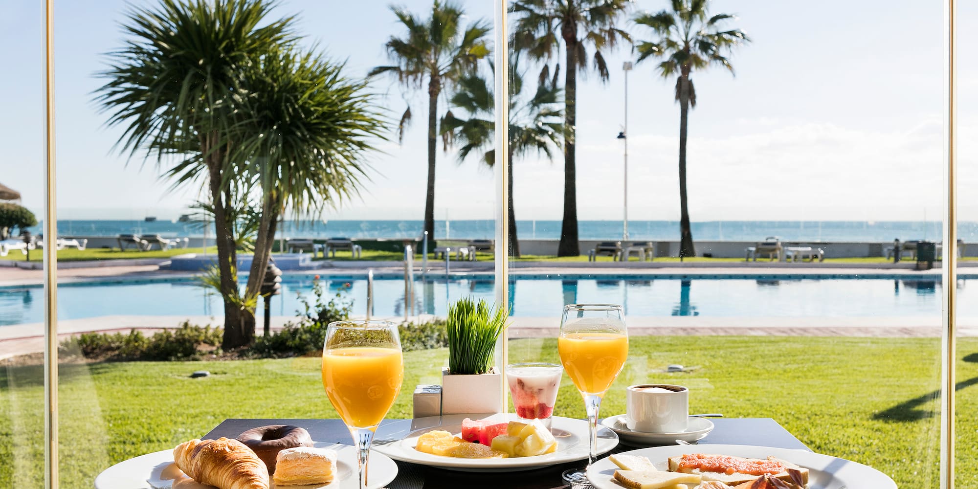 a table with plates of food and drinks on it