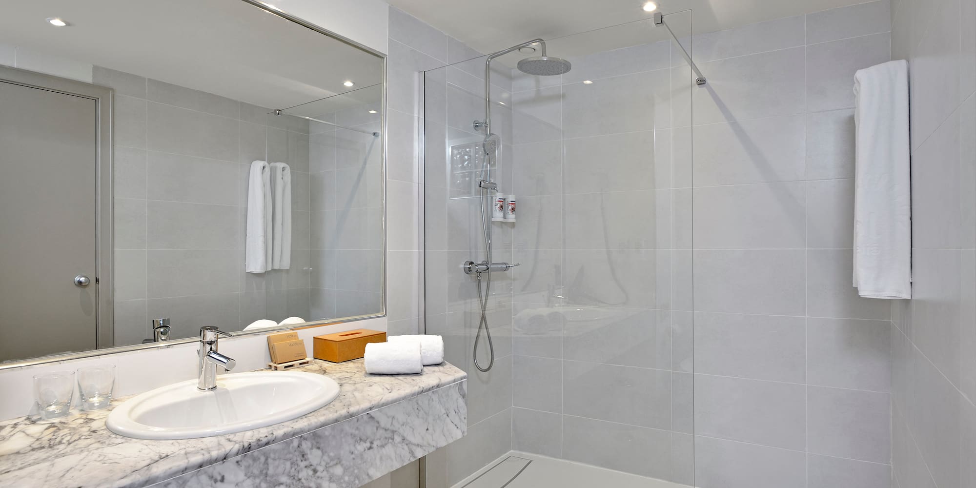 a bathroom with a shower and sink