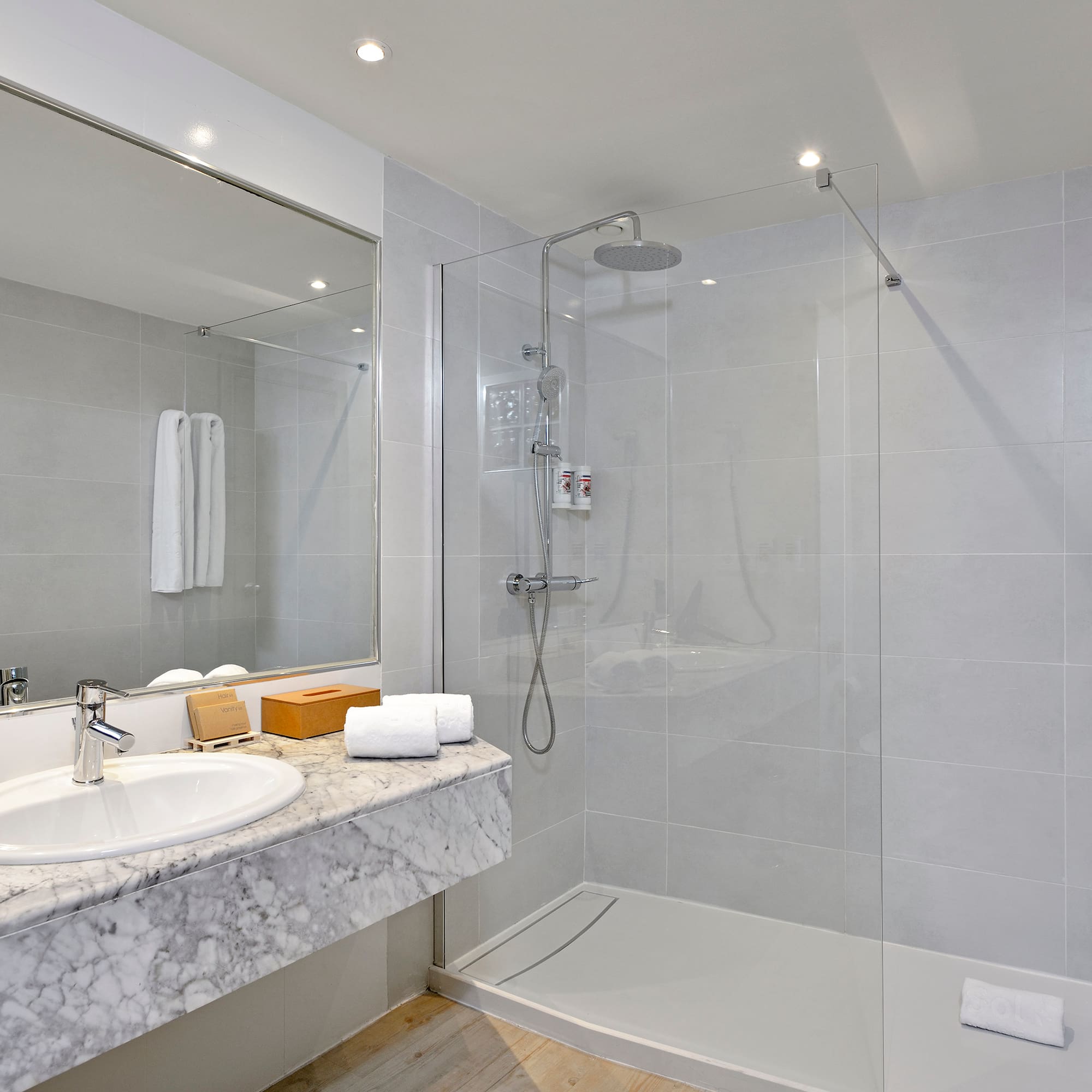 a bathroom with a shower and sink