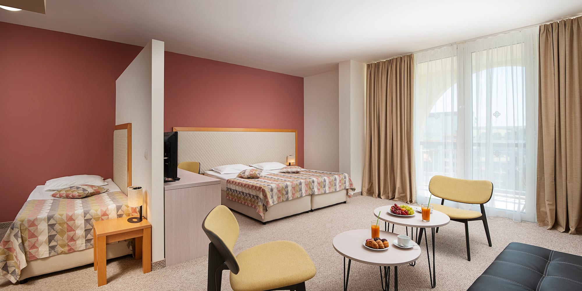 a room with a bed and a tv