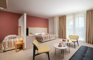 a room with a bed and a tv