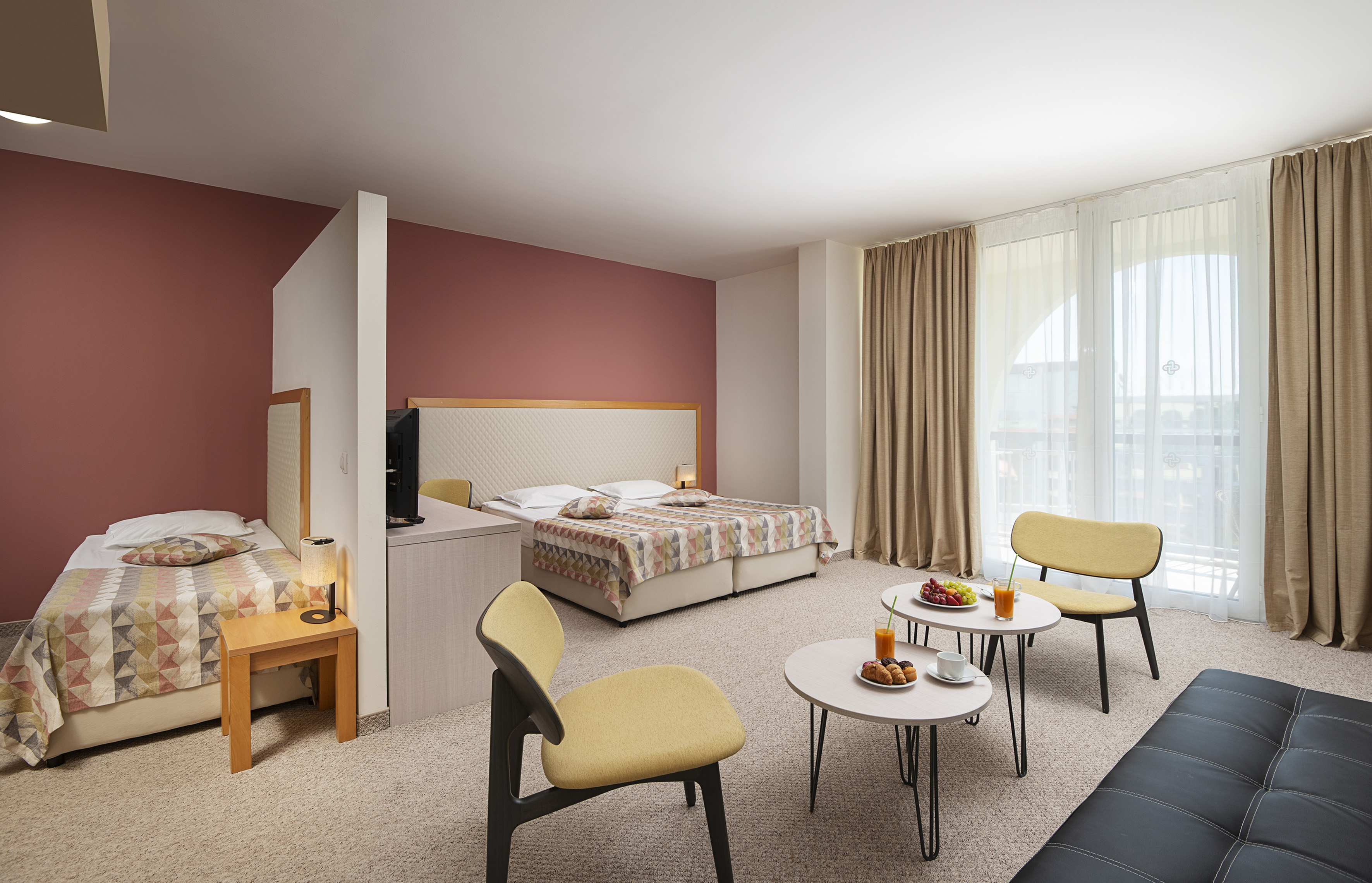 a room with a bed and a tv