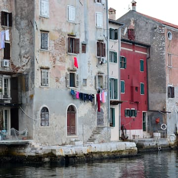 a row of buildings by a body of water