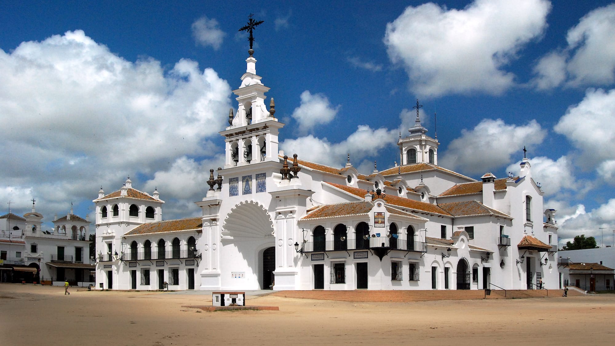 a white building with a cross on top