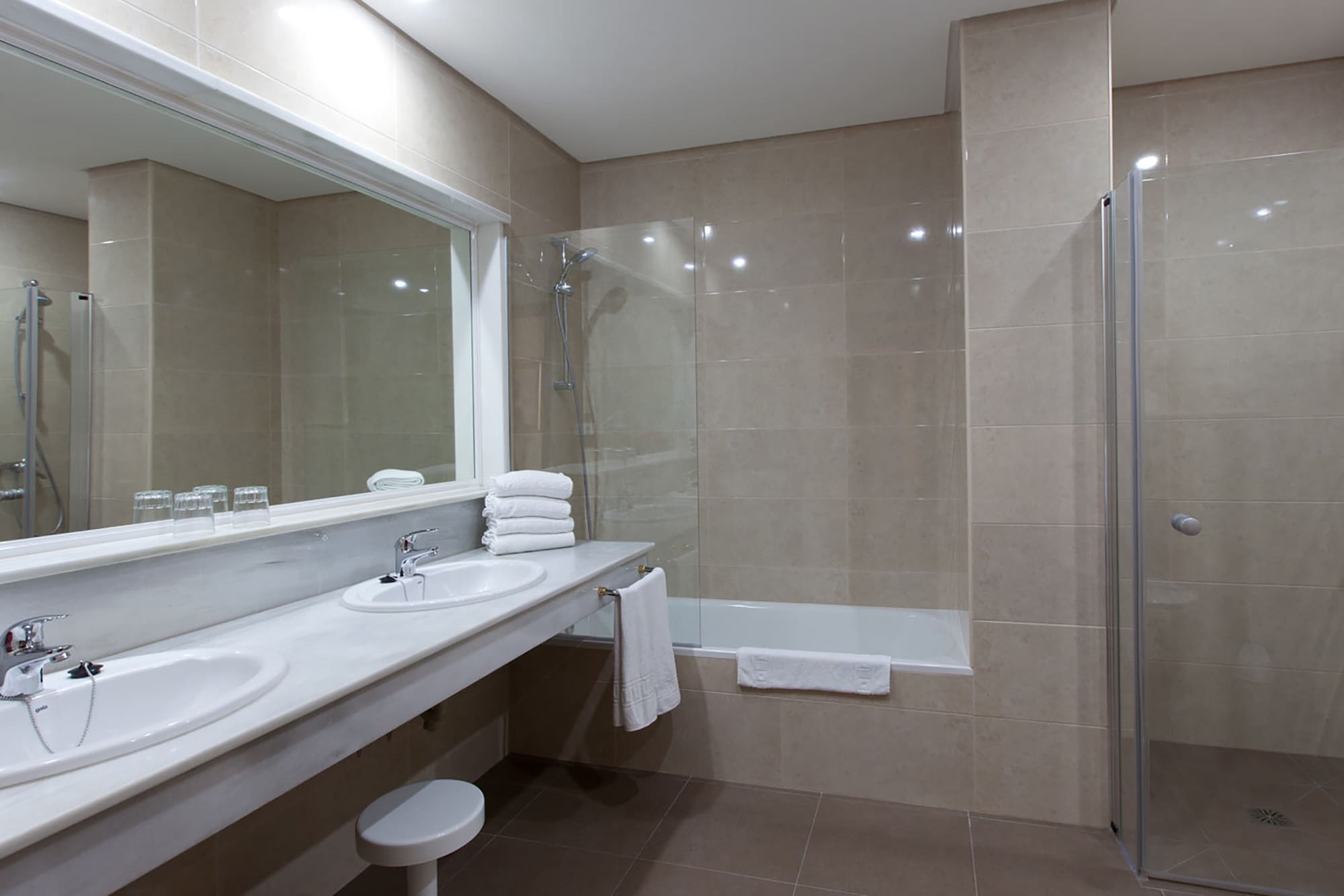 a bathroom with a shower and sink